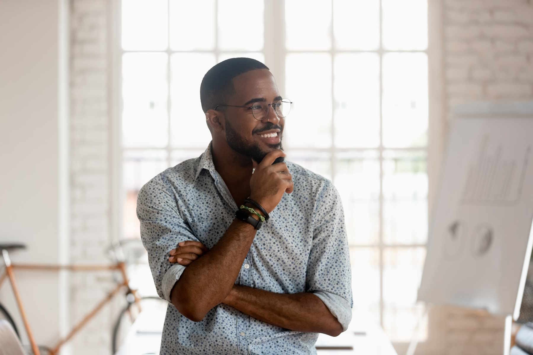 Thoughtful Happy African American Millennial Businessman